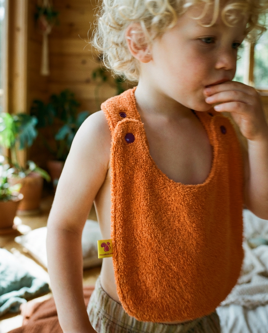Reversible Bib terry orange/muslin mauve