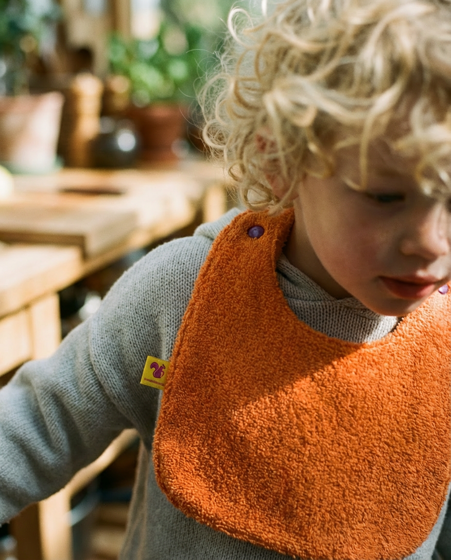 Reversible Bib terry orange/muslin mauve