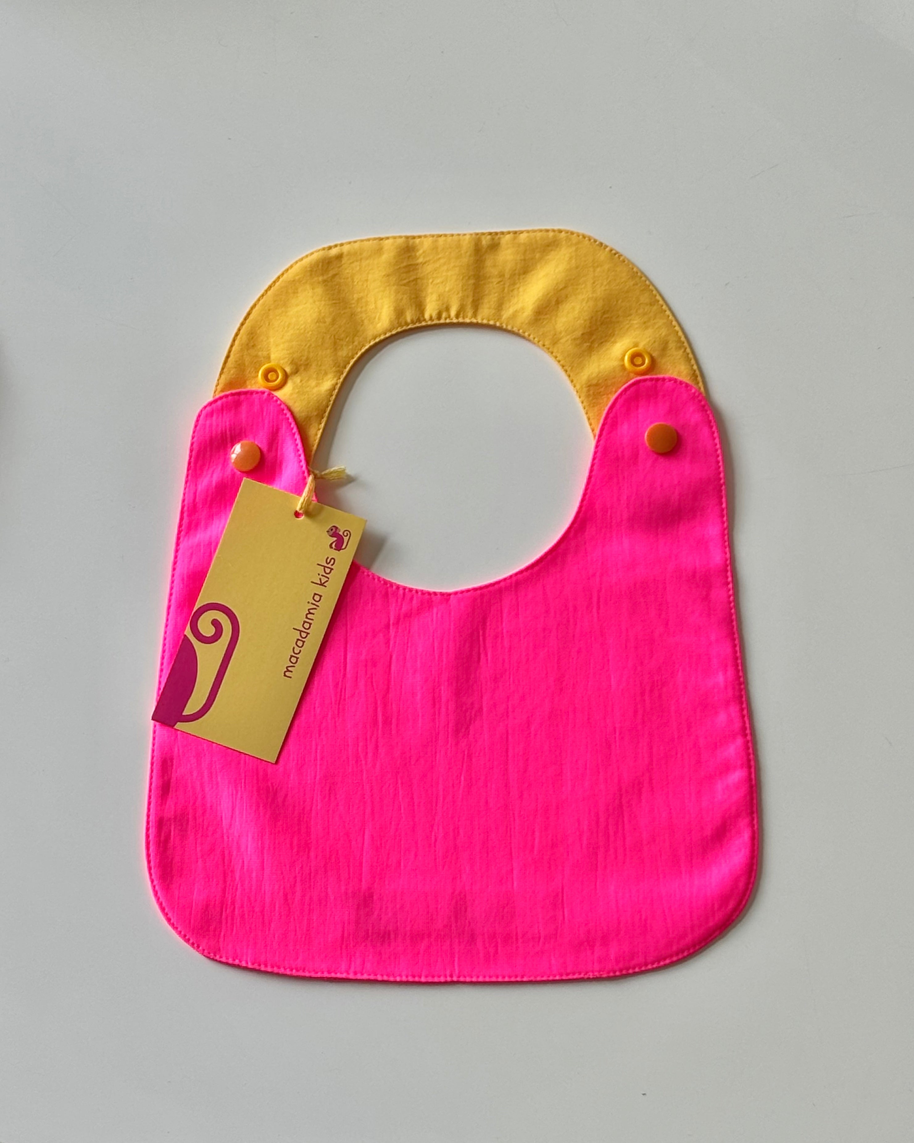 Reversible Bib fuchsia y yellow