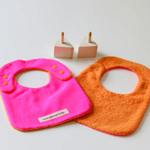 Reversible Bib orange/fuchsia cotton terry