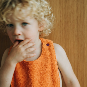 Reversible Bib terry orange/muslin mauve