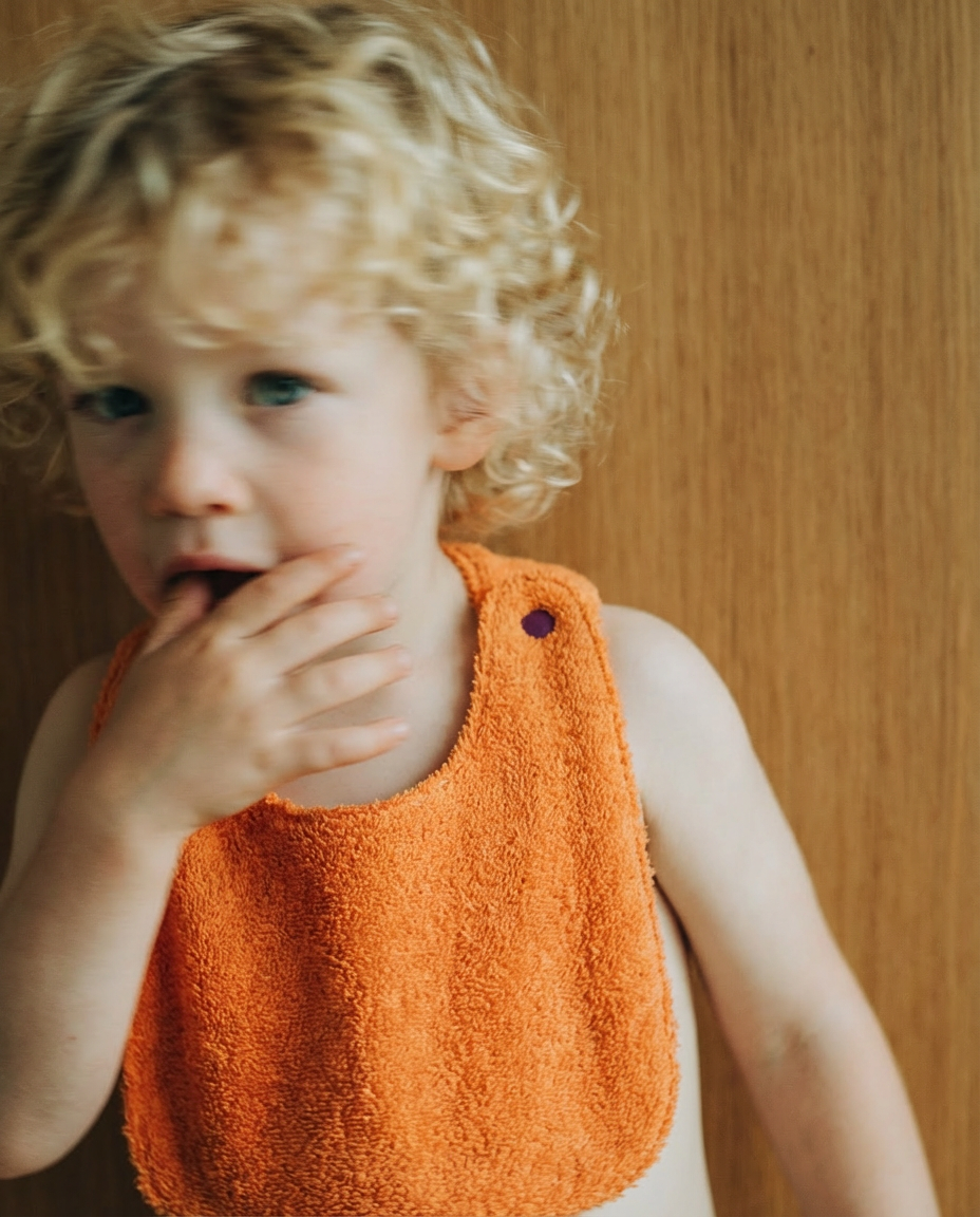 Reversible Bib terry orange/muslin mauve