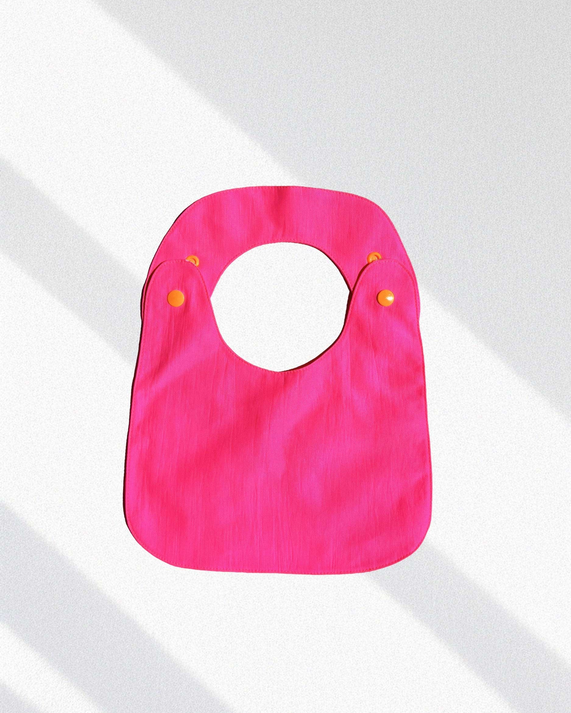 Reversible Bib fuchsia
