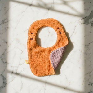 Reversible Bib terry orange/muslin mauve