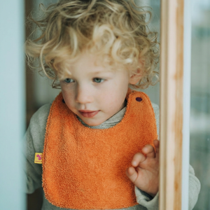 Reversible Bib terry orange/muslin mauve