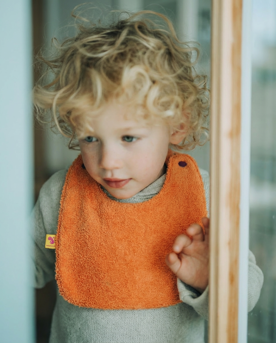 Reversible Bib terry orange/muslin mauve