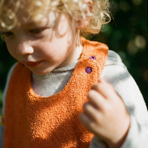 Reversible Bib terry orange/muslin mauve