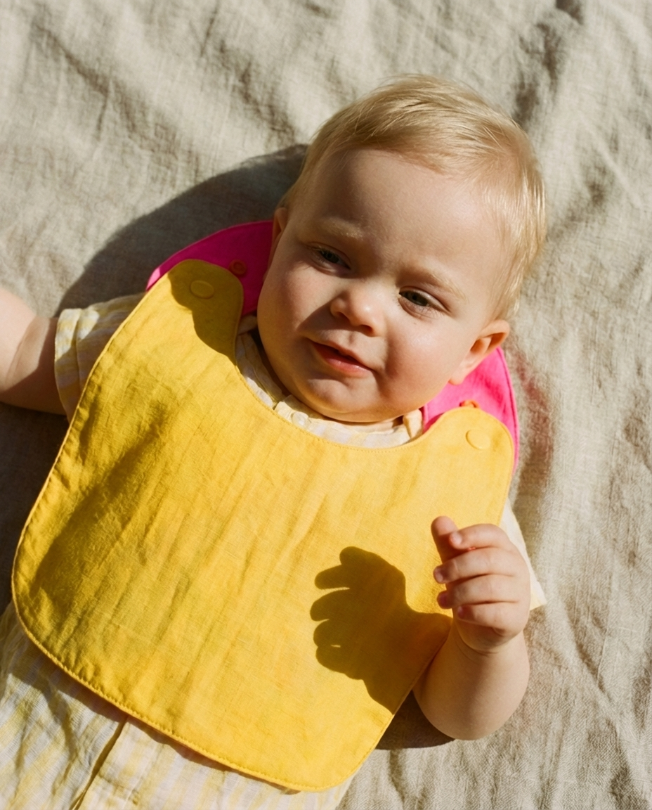 Reversible Bib yellow/fuchsia
